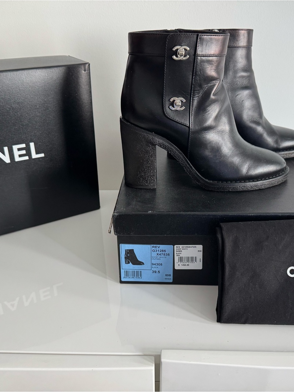 CHANEL Black Leather Ankle Boots with Silver CC Emblems
